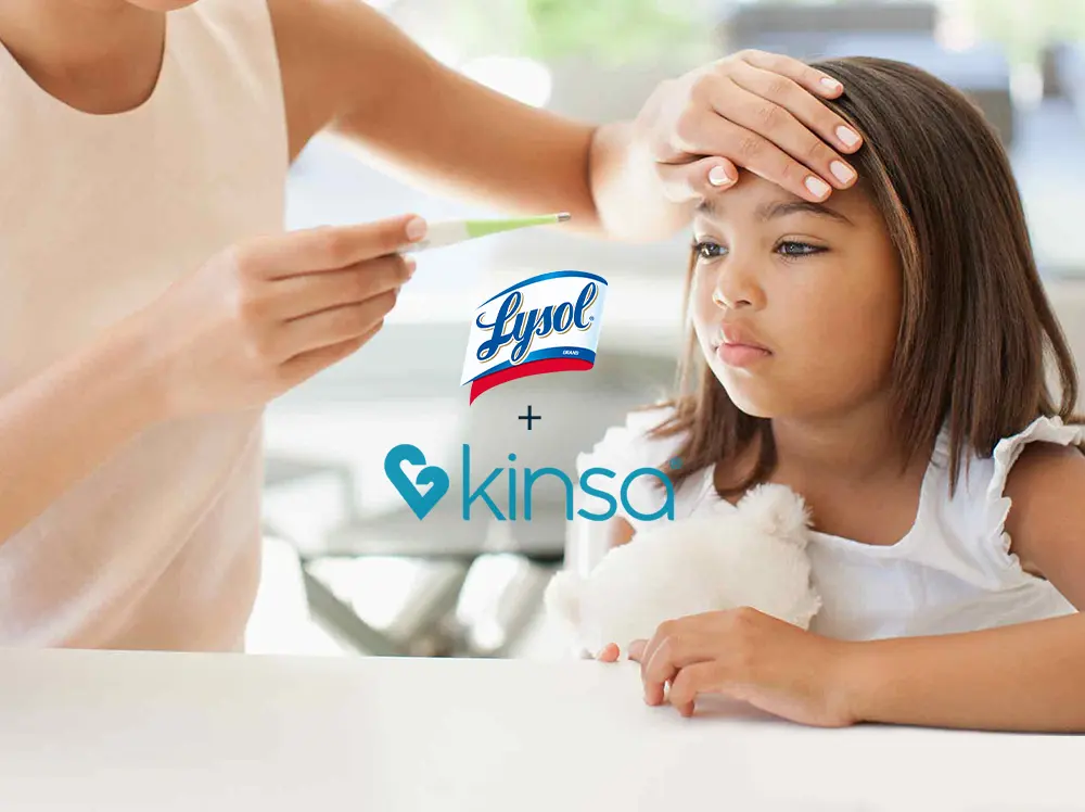Parent looking at thermometer while holding hand to forehead of unhappy child. The Lysol and Kinsa logos overlay the image.
